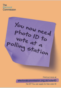 Photo of post it note saying "You now need photo ID to vote at a polling station."